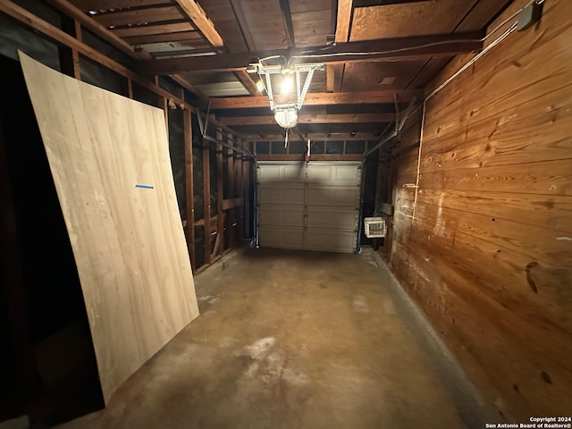 garage with wood walls