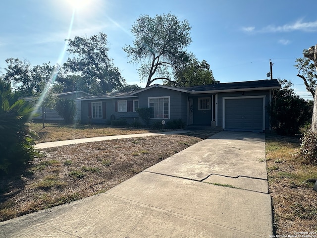 single story home with a garage