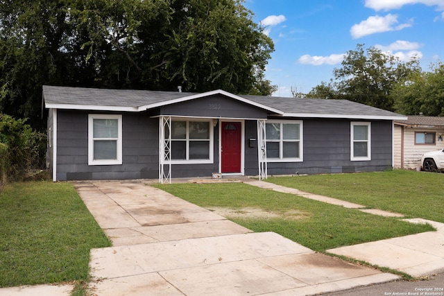 single story home featuring a front yard