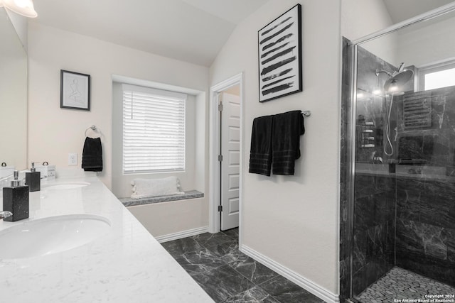 bathroom featuring lofted ceiling, marble finish floor, a stall shower, a sink, and baseboards