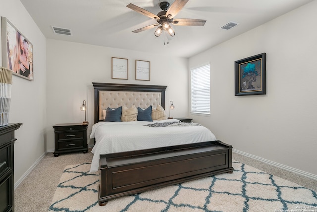 bedroom featuring ceiling fan and light carpet