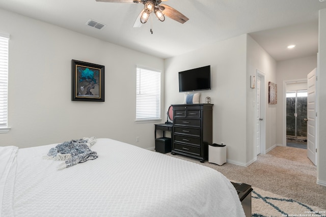 carpeted bedroom featuring ceiling fan