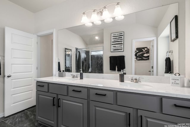 bathroom with lofted ceiling, vanity, a shower with shower door, and a textured ceiling