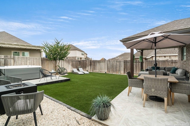 view of yard featuring a patio area, a hot tub, outdoor dining area, and a fenced backyard