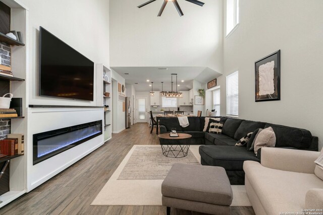 entrance foyer with dark hardwood / wood-style flooring and a notable chandelier