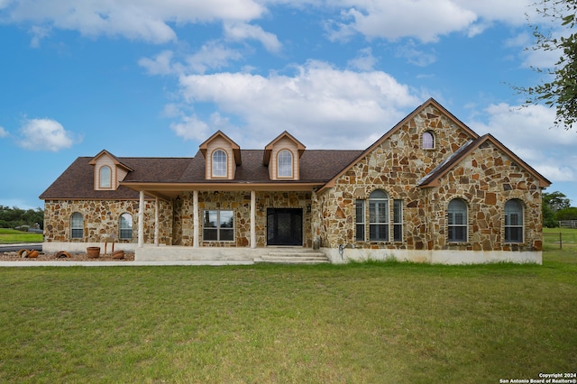 view of front of home with a front yard