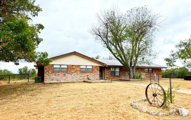 ranch-style home with central AC unit