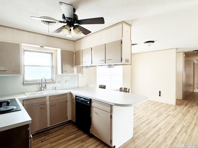 kitchen with light hardwood / wood-style floors, sink, black appliances, kitchen peninsula, and ceiling fan