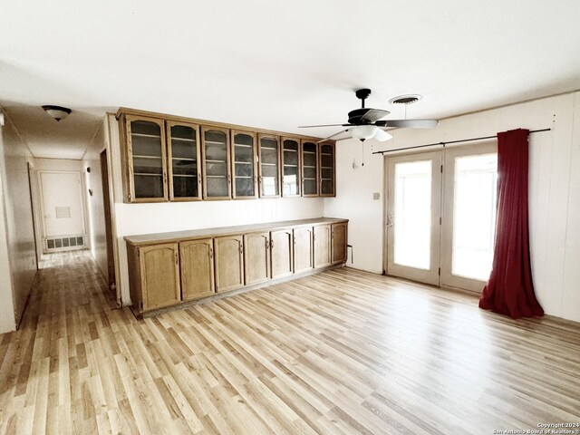 kitchen with ceiling fan and light hardwood / wood-style floors