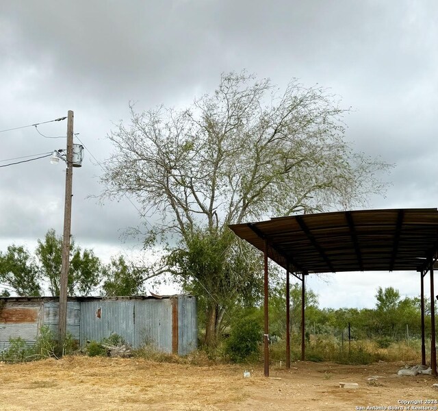 exterior space with a carport