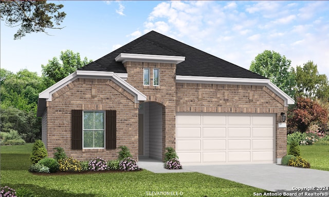 view of front facade with a garage and a front yard