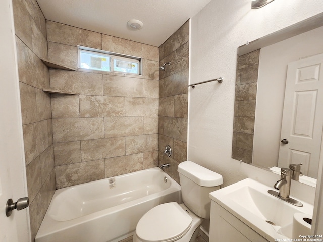 full bathroom with tiled shower / bath combo, vanity, and toilet