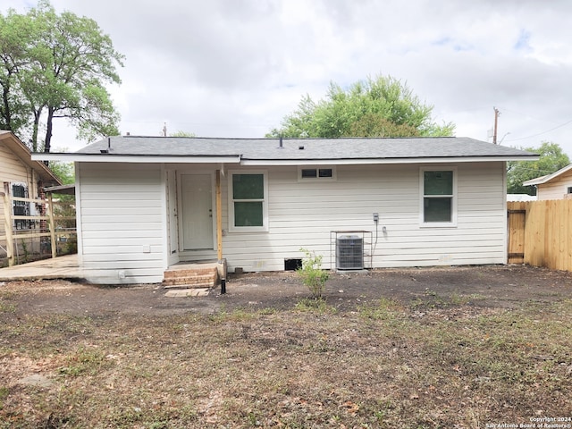 back of property featuring central AC unit