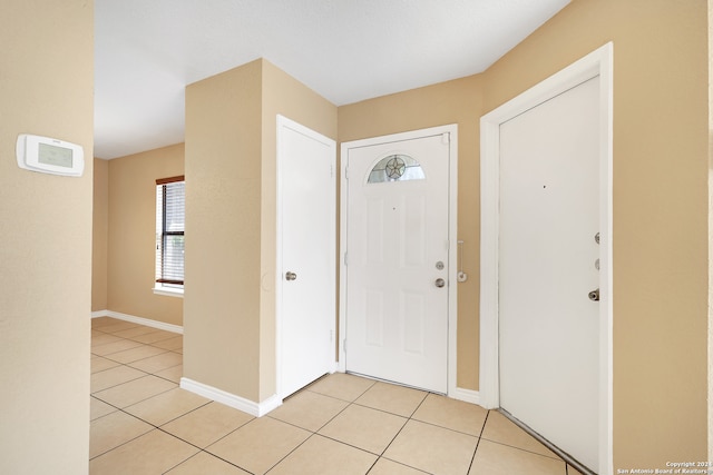 entrance foyer with light tile patterned floors