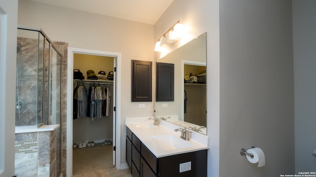 bathroom with vanity and an enclosed shower