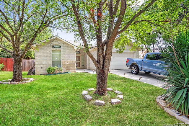 single story home with a front lawn and a garage