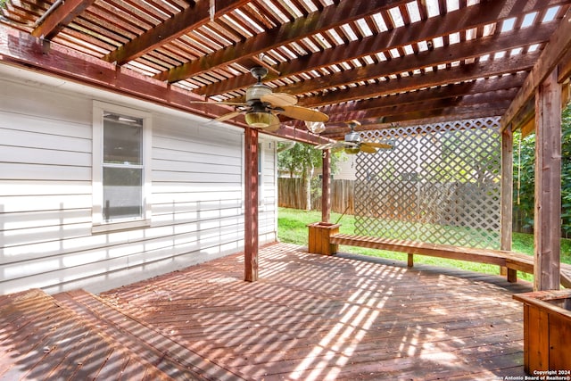 deck with a pergola, a lawn, and ceiling fan