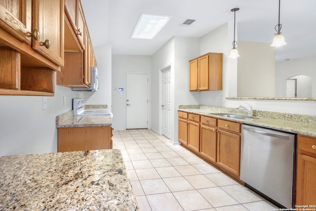 kitchen featuring light stone countertops, white appliances, pendant lighting, light tile patterned floors, and sink