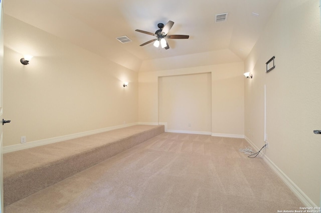 unfurnished room featuring a ceiling fan, light colored carpet, visible vents, and baseboards