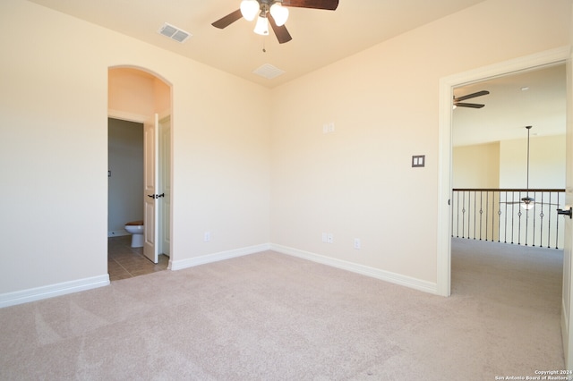 carpeted empty room with ceiling fan