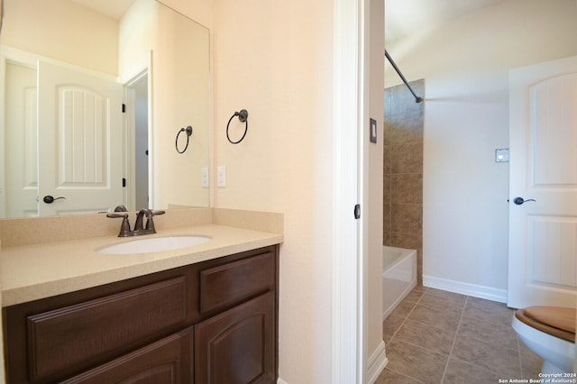 full bathroom featuring bathtub / shower combination, tile patterned flooring, toilet, vanity, and baseboards