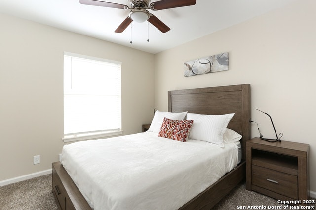 carpeted bedroom with ceiling fan