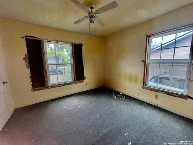 spare room with ceiling fan