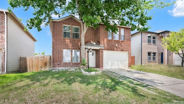 traditional home featuring concrete driveway, an attached garage, fence, a front lawn, and brick siding