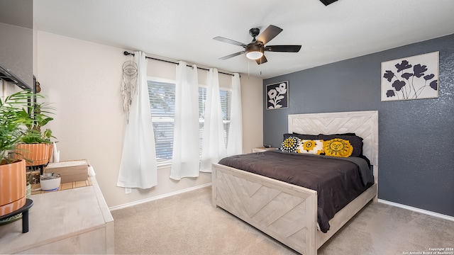 bedroom with ceiling fan and carpet flooring