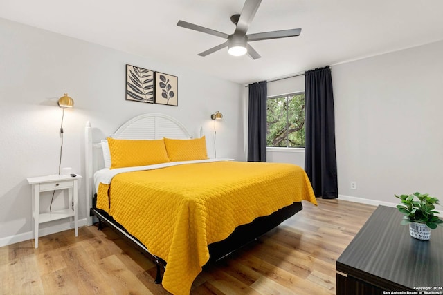 bedroom featuring light hardwood / wood-style floors and ceiling fan