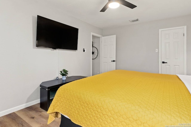 bedroom featuring hardwood / wood-style floors and ceiling fan