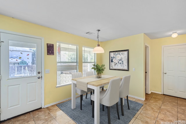 dining space with light tile patterned flooring