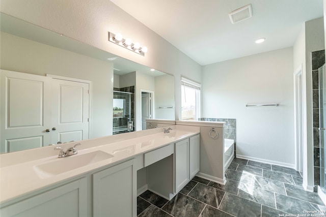 bathroom featuring vanity and plus walk in shower