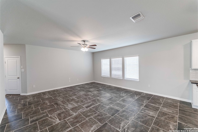 unfurnished room featuring ceiling fan