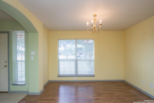 interior space featuring a notable chandelier and hardwood / wood-style flooring