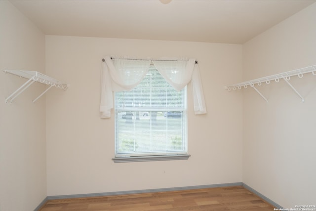 spacious closet with light hardwood / wood-style floors