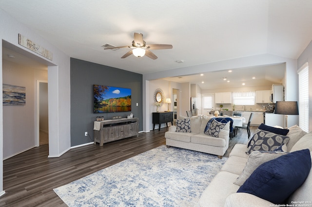 living room with vaulted ceiling, sink, ceiling fan, and dark hardwood / wood-style floors