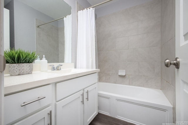 bathroom featuring shower / bath combo and vanity