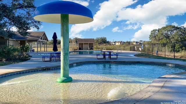 view of pool featuring a patio area