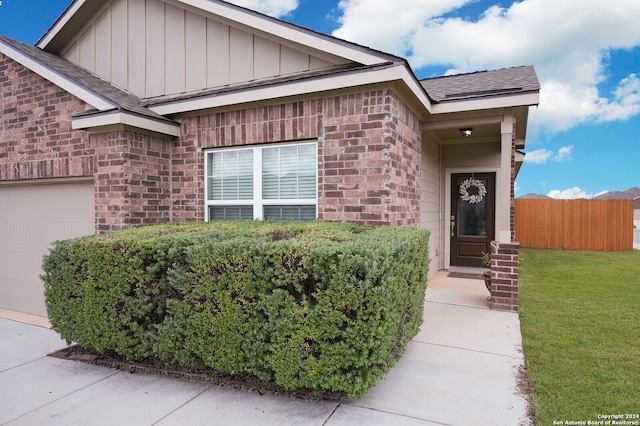 view of front facade with a front yard and a garage