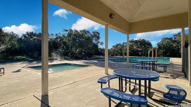 view of patio featuring a community pool