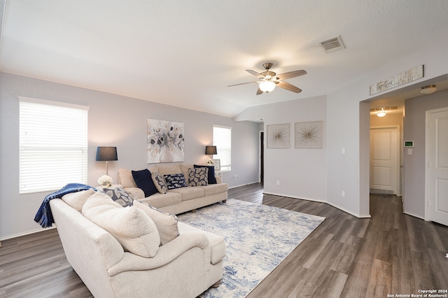 living room with ceiling fan and dark hardwood / wood-style flooring