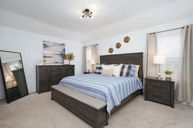 bedroom featuring light colored carpet