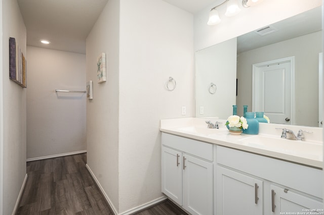 bathroom with hardwood / wood-style flooring and vanity