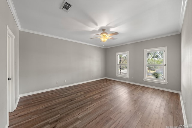 empty room featuring hardwood / wood-style floors, ceiling fan, and crown molding