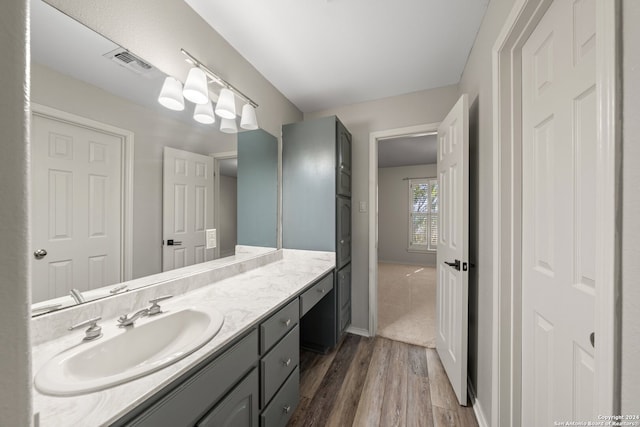 bathroom featuring hardwood / wood-style floors and vanity