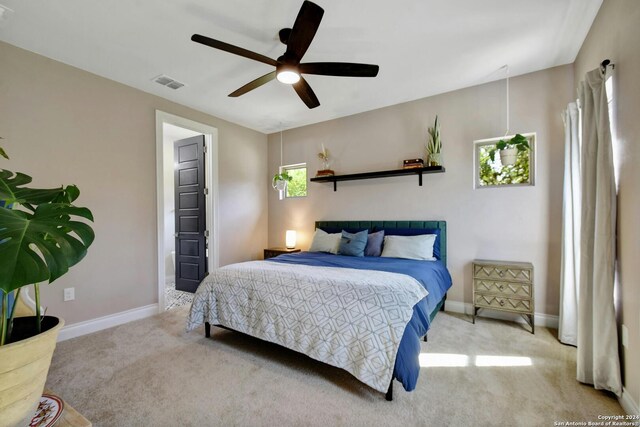 carpeted bedroom with ceiling fan