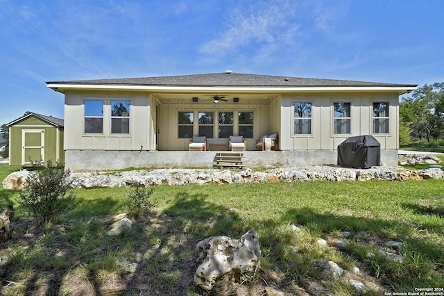 back of property featuring a patio area, a yard, an outdoor hangout area, ceiling fan, and a storage shed