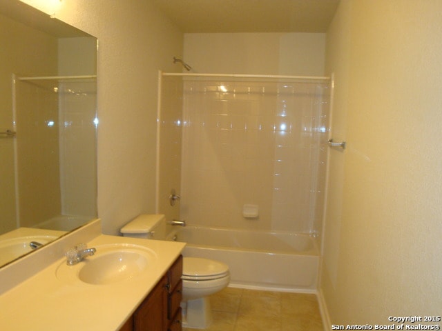 full bathroom with vanity, toilet, tile patterned floors, and bathing tub / shower combination