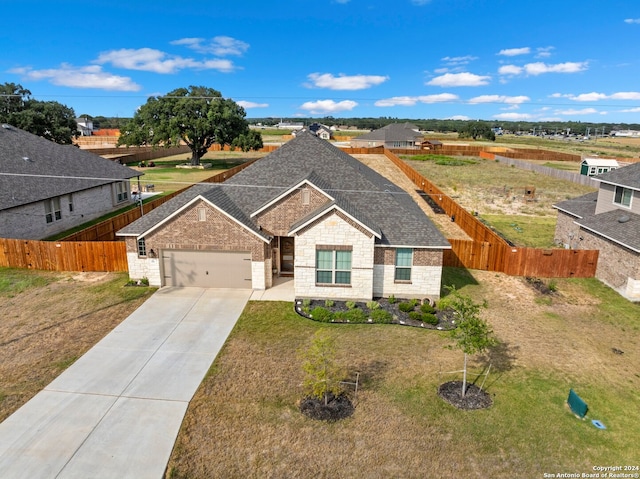 view of front facade with a garage and a front yard